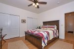 The master bedroom features a queen size bed 